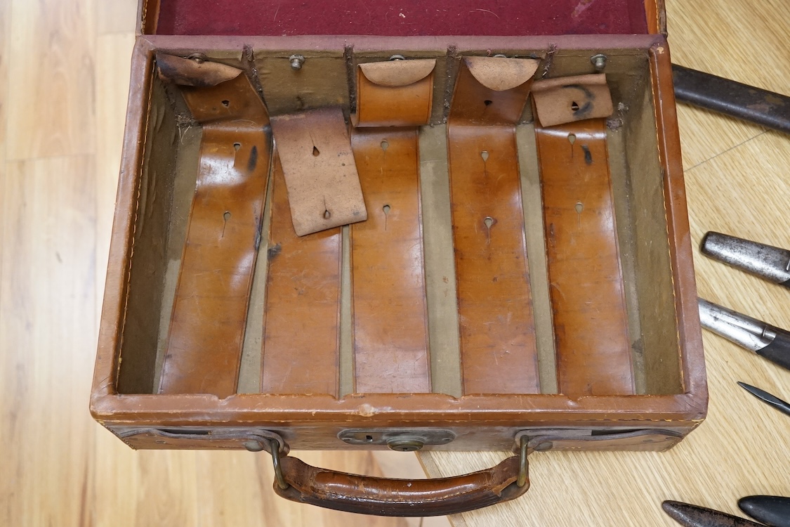 A Harrods brown leather gun/ammunition case, the lid with five leather restraining straps inside, and a good Harrods Ltd. Gun and Rifle Dept. label to the inside of the lid, dimensions; 40cm wide, 29cm high, 12.5cm deep
